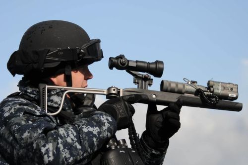 U.S. Navy Chief Fire Controlman Kevin Barnett, assigned to the guided missile destroyer USS Forrest Sherman (DDG 98), uses an LA9P nonlethal visual disruption laser to deter a simulated small boat attack during exercise Joint Warrior 2012 April 17, 2012, in the Atlantic Ocean. Joint Warrior is a United Kingdom-led multi-warfare exercise designed to improve interoperability between allied navies and prepare participating crews to conduct combined operations while deployed. (DoD photo by Mass Communication Specialist 2nd Class Katerine Noll, U.S. Navy/Released)
